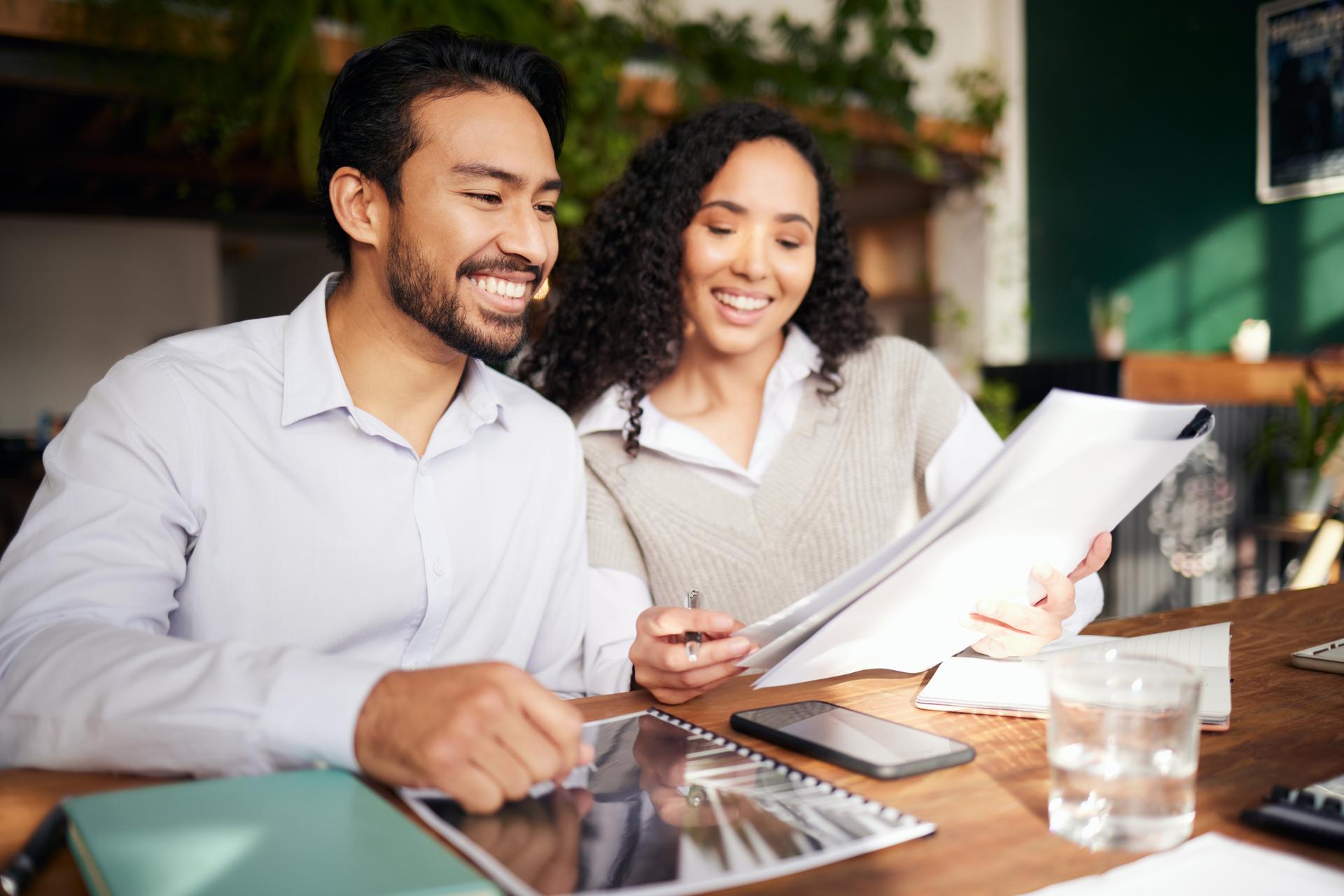 Collaboration, documents and meeting with a business team in the office and working together on a report. Teamwork, planning or strategy with man, woman and employee colleagues at work on a proposal